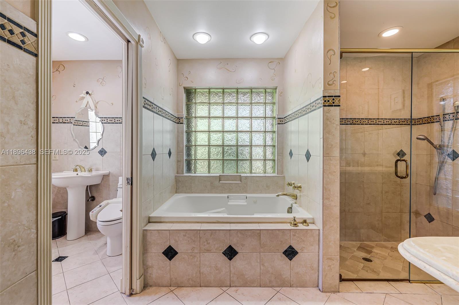 10101 Southwest 5th Street Plantation, FL 33324 - Photo 35 of 77 a bathroom with a tub a toilet and a shower