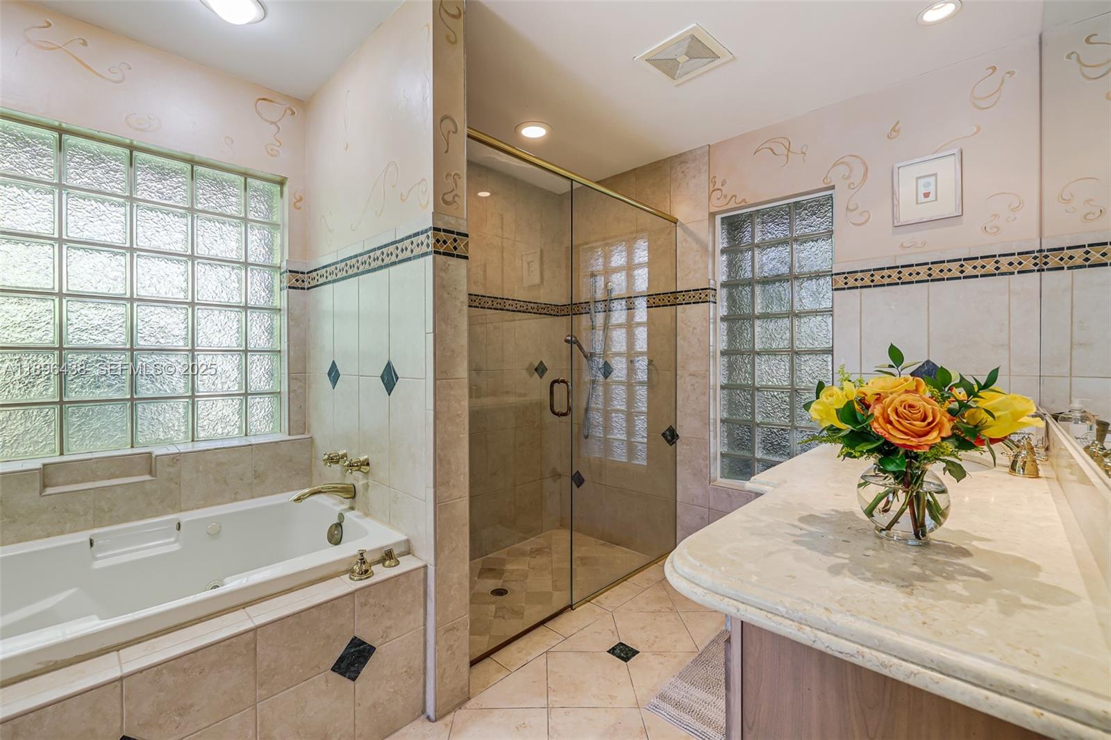 10101 Southwest 5th Street Plantation, FL 33324 - Photo 36 of 77 a bathroom with a sink shower and a bathtub