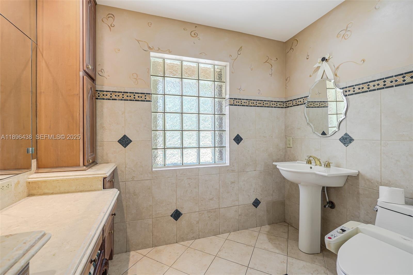10101 Southwest 5th Street Plantation, FL 33324 - Photo 37 of 77 a bathroom with a sink toilet and shower