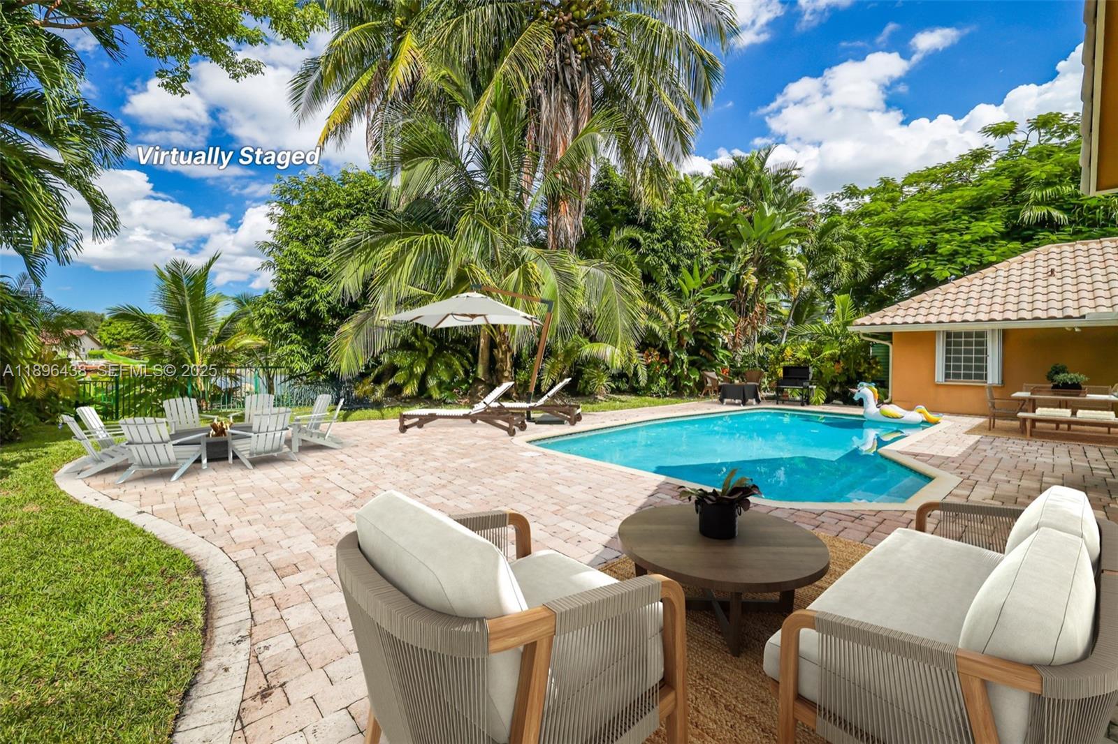 10101 Southwest 5th Street Plantation, FL 33324 - Photo 50 of 77 a swimming pool with outdoor seating and yard