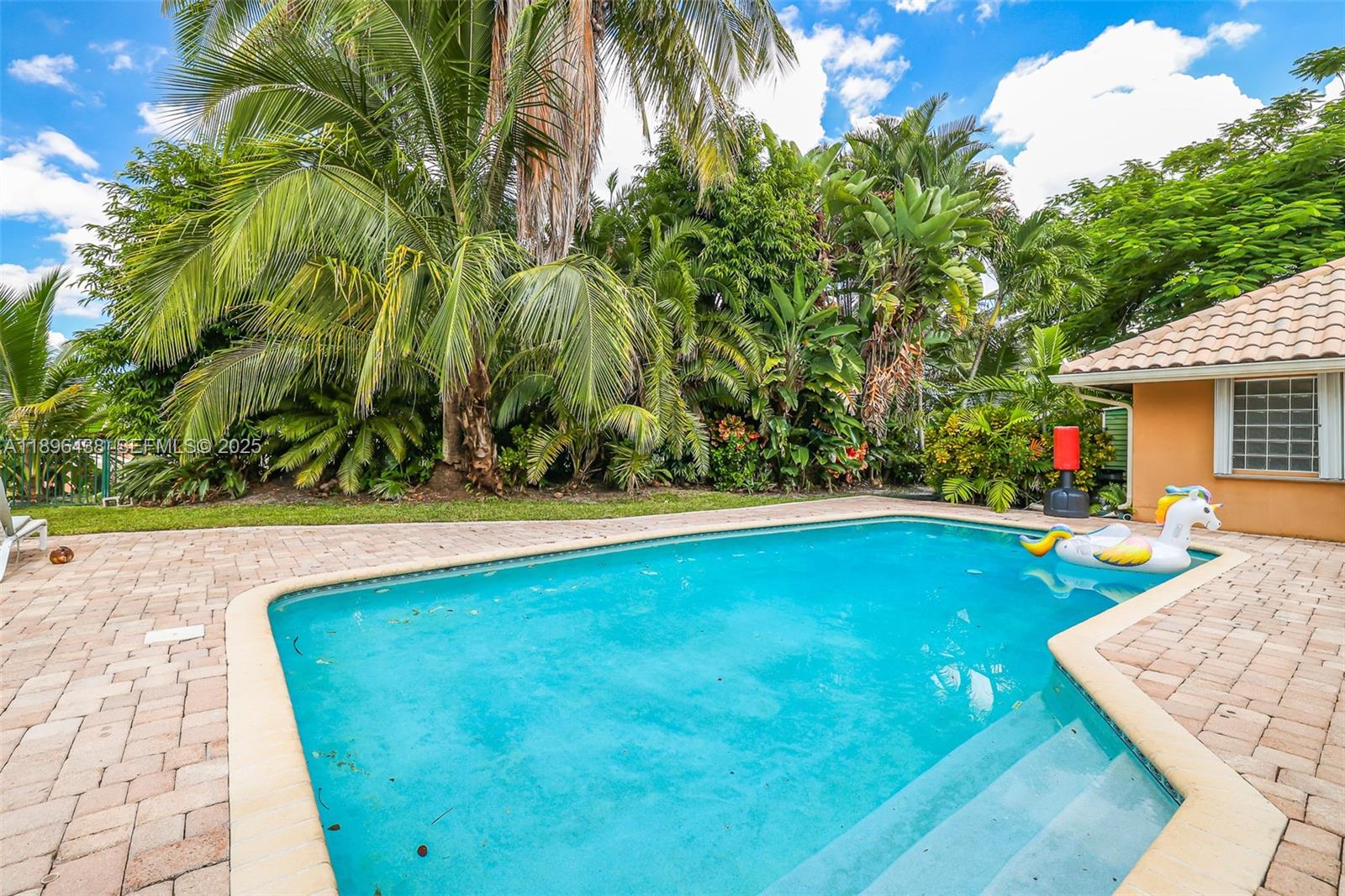10101 Southwest 5th Street Plantation, FL 33324 - Photo 56 of 77 a view of a backyard with swimming pool