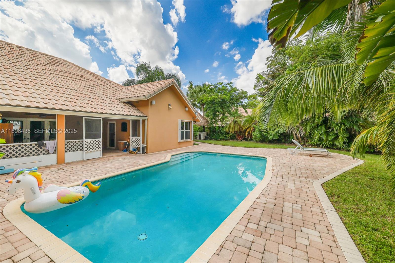 10101 Southwest 5th Street Plantation, FL 33324 - Photo 58 of 77 a view of house with swimming pool outdoor seating