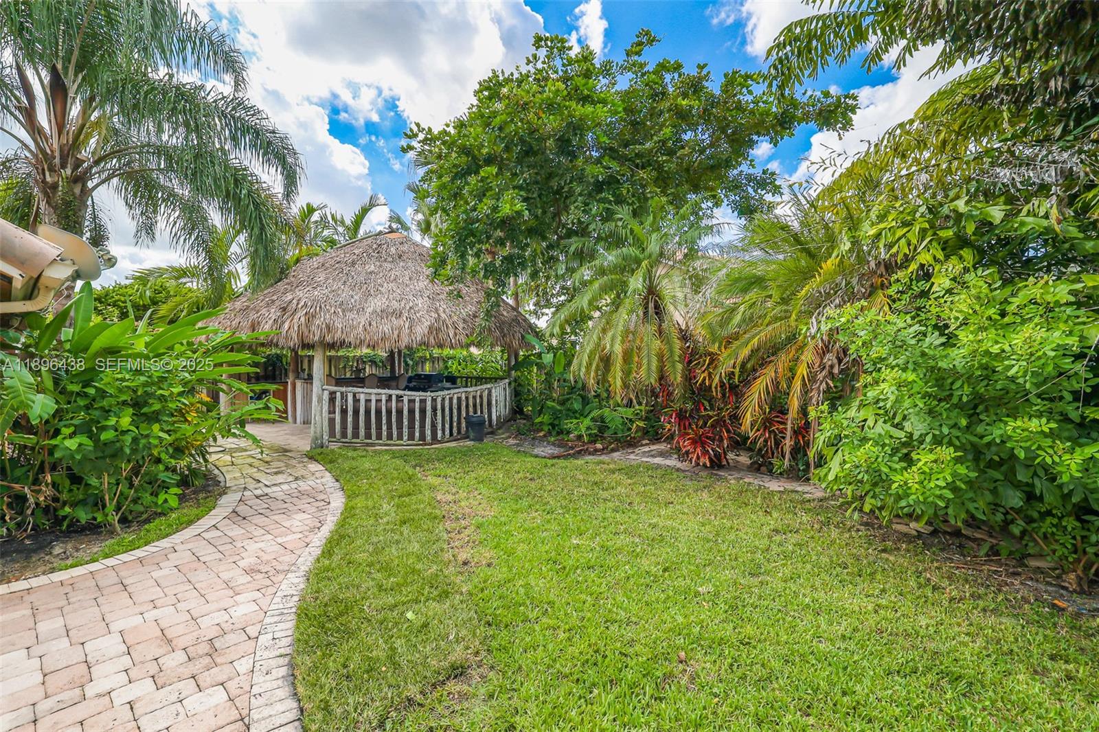 10101 Southwest 5th Street Plantation, FL 33324 - Photo 59 of 77 a view of a garden with a deck