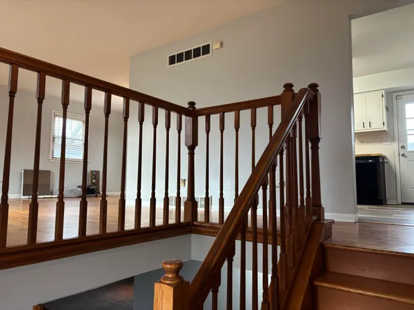 a view of a porch with wooden floor