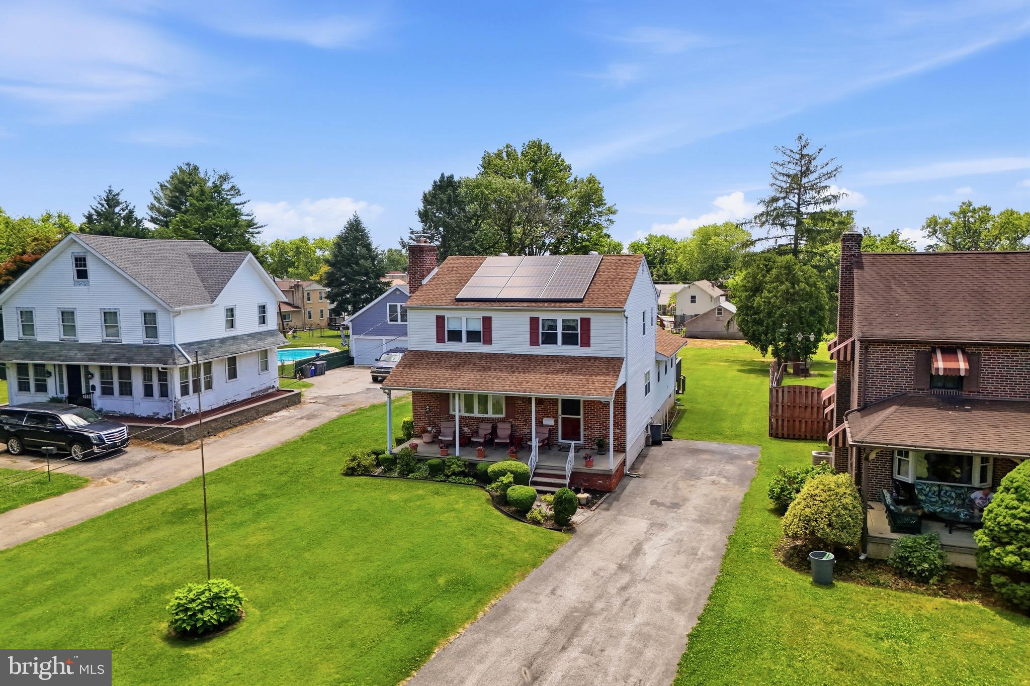 1004 Green Lane Secane, PA 19018 - Photo 36 of 49 an aerial view of a house with swimming pool and garden