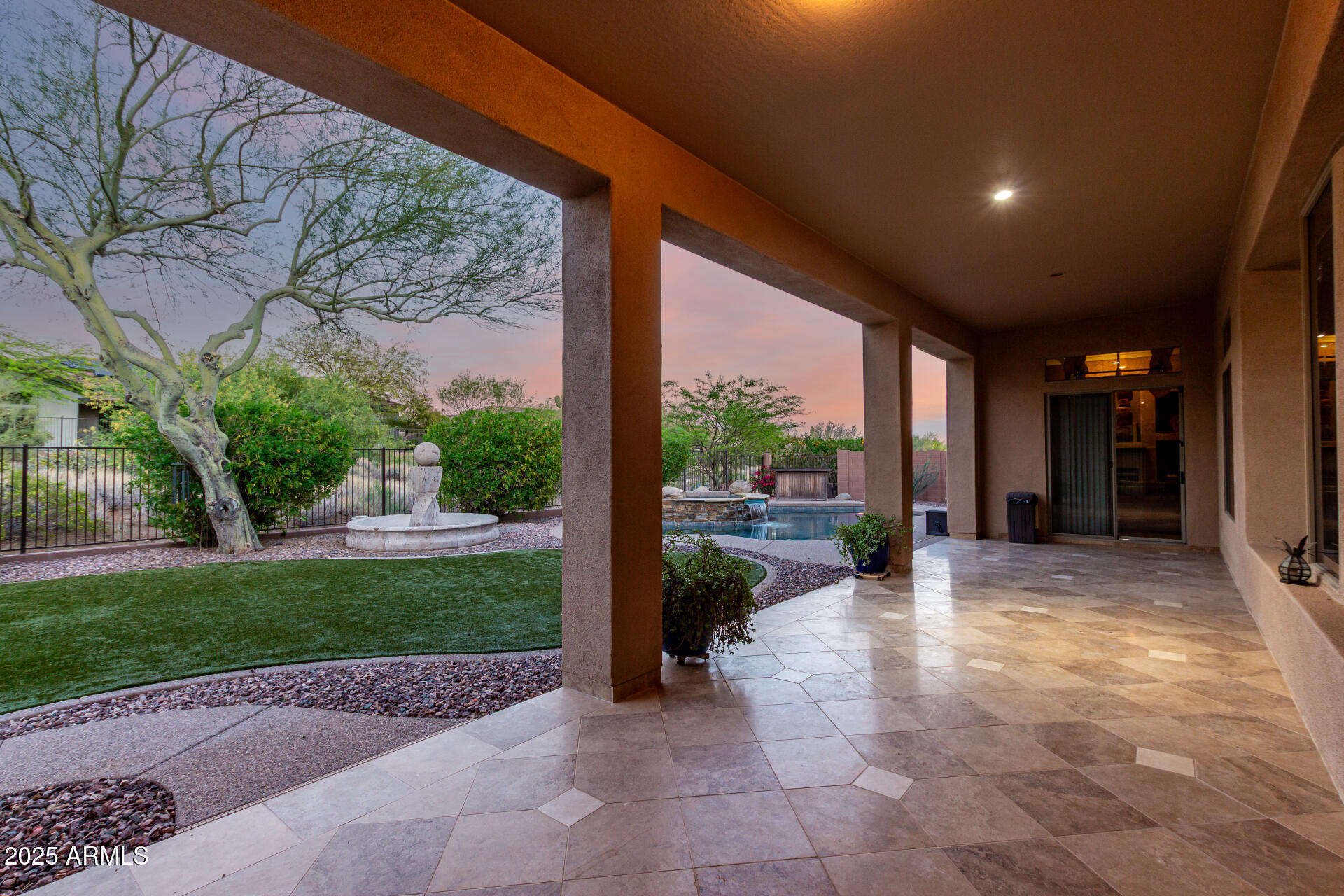 41715 North River Bend Road Phoenix, AZ 85086 - Photo 15 of 60 a view of a patio with chairs and a yard