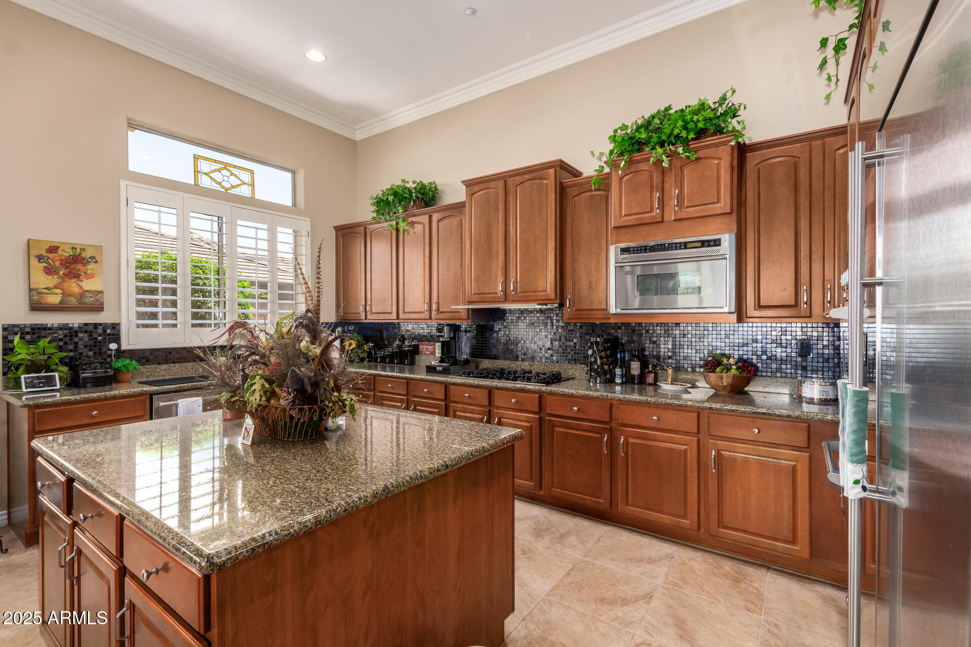 41715 North River Bend Road Phoenix, AZ 85086 - Photo 27 of 60 a kitchen with sink a window and chairs