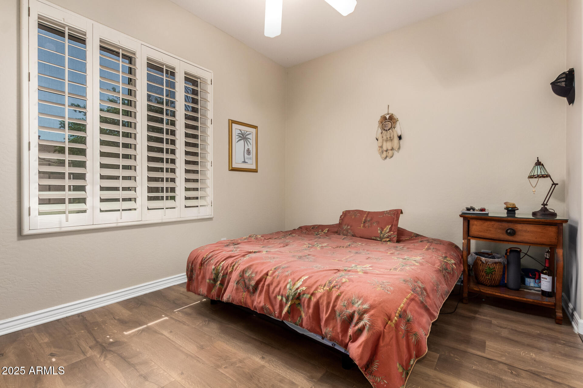 41715 North River Bend Road Phoenix, AZ 85086 - Photo 37 of 60 a bedroom with a bed and wooden floor