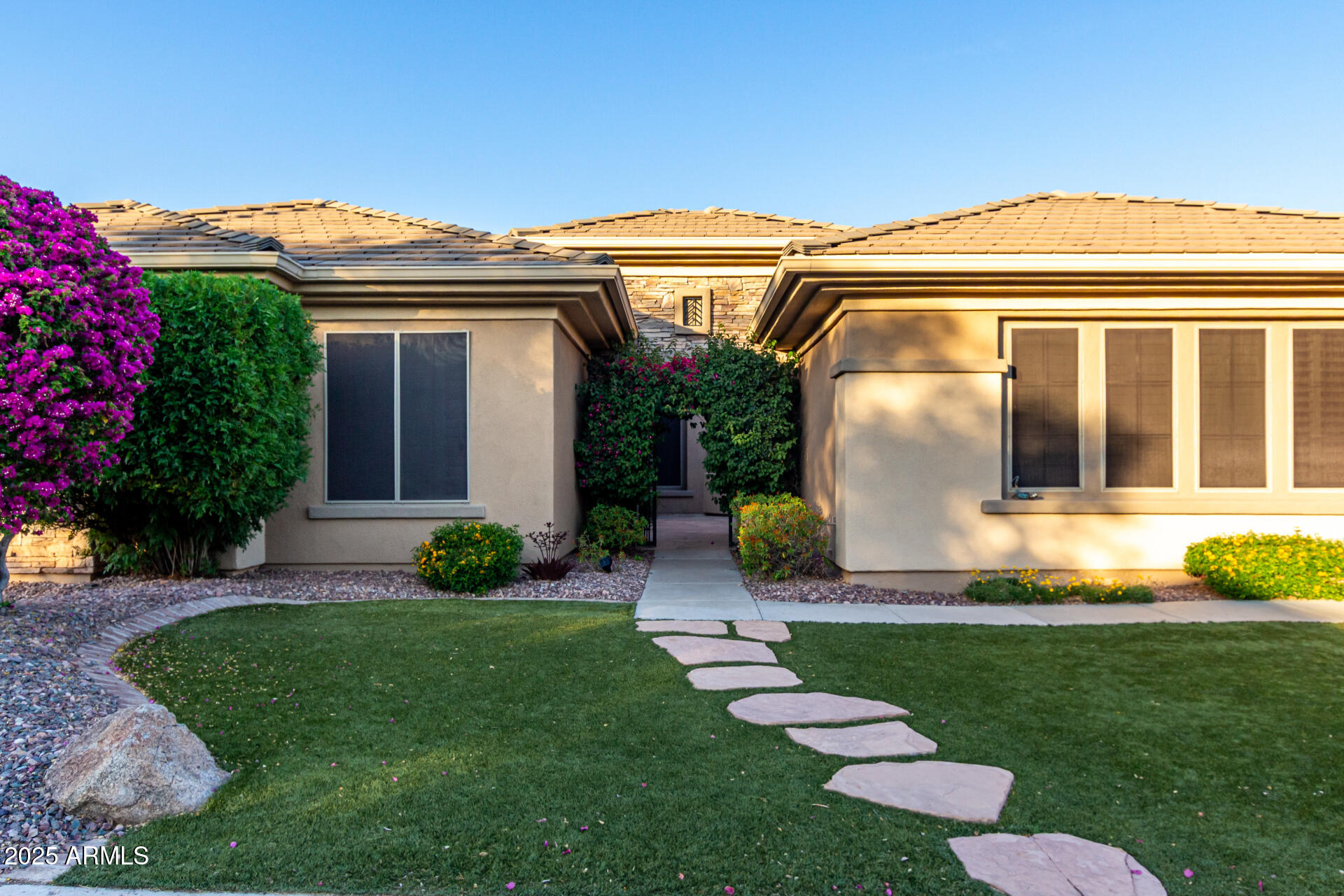 41715 North River Bend Road Phoenix, AZ 85086 - Photo 39 of 60 a view of a white house with a big yard and potted plants
