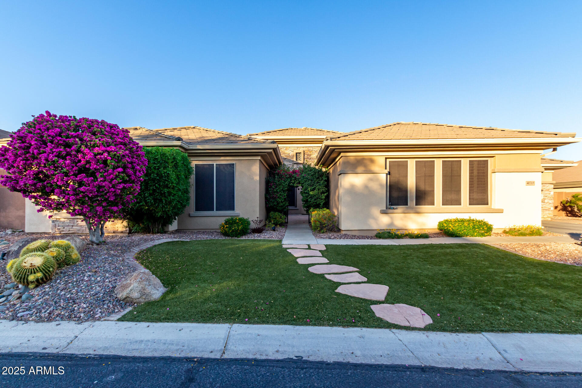 41715 North River Bend Road Phoenix, AZ 85086 - Photo 52 of 60 a front view of a house with garden