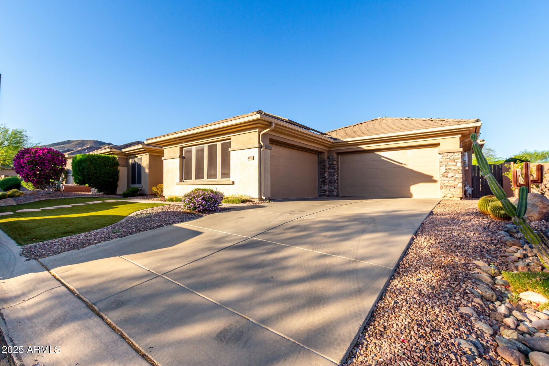 41715 North River Bend Road Phoenix, AZ 85086 - Photo 55 of 60 a front view of a house with a yard