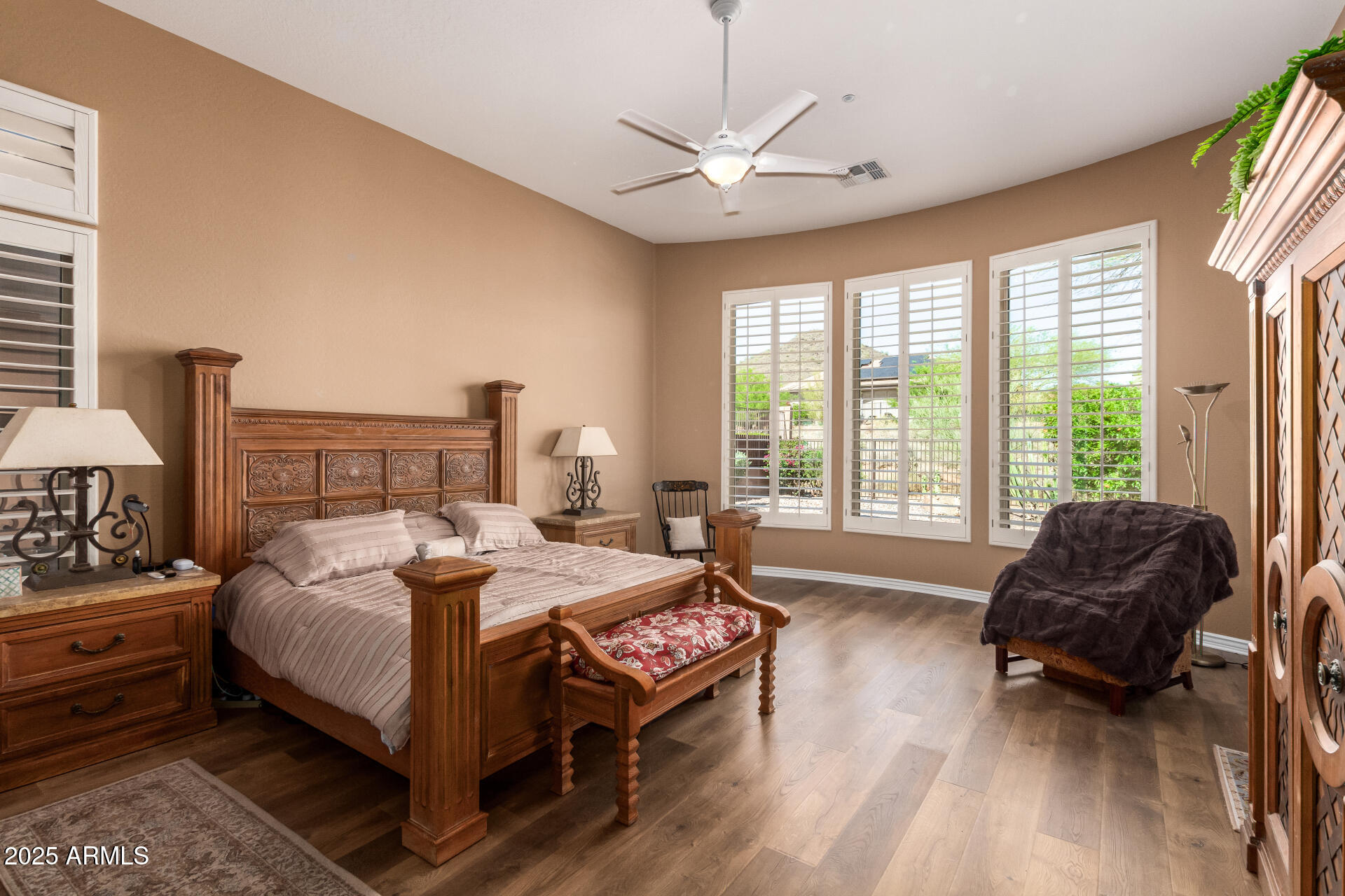 41715 North River Bend Road Phoenix, AZ 85086 - Photo 8 of 60 a bedroom with a bed a couch and a chandelier