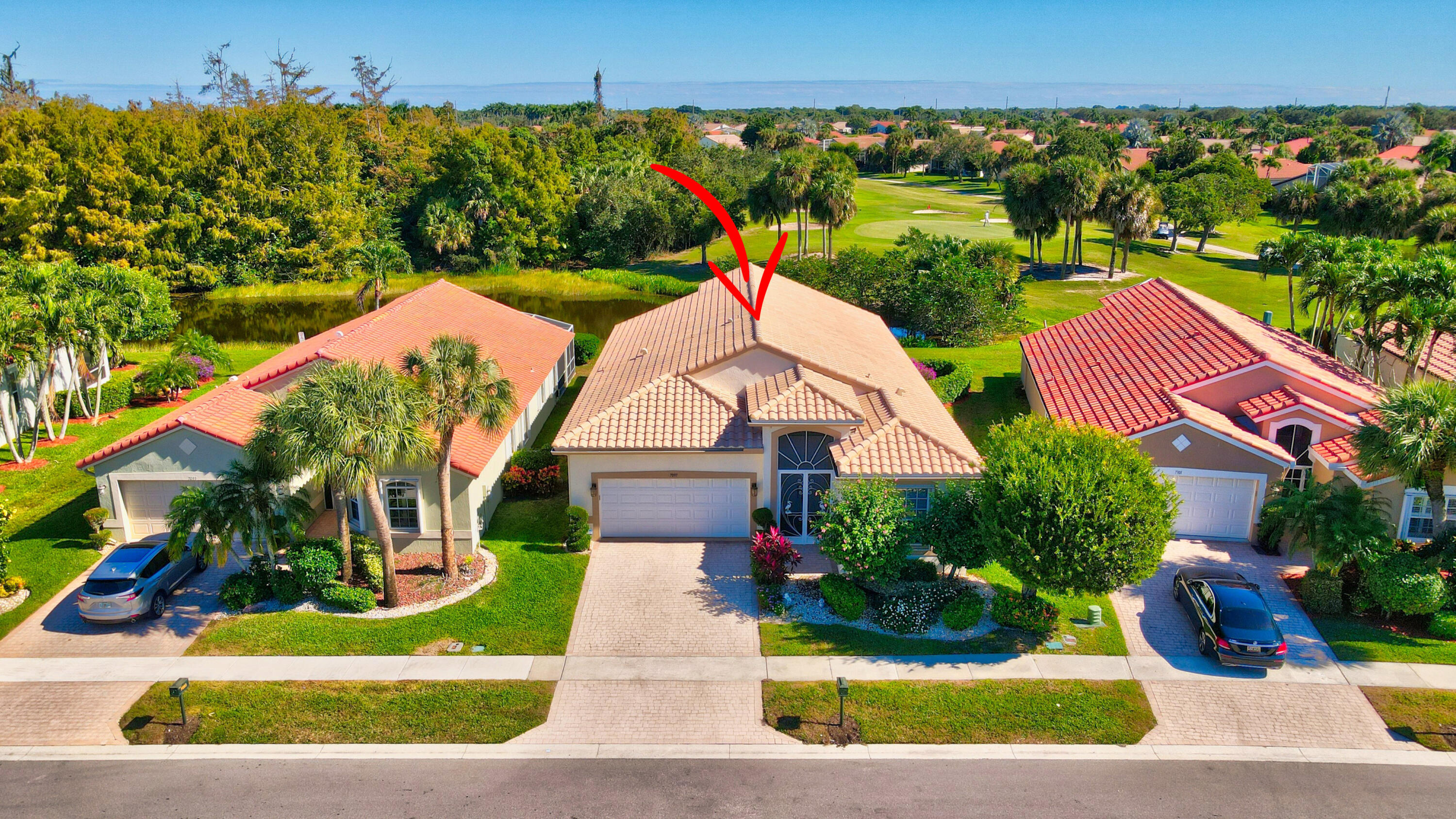 7097 Haviland Circle Boynton Beach, FL 33437 - Photo 2 of 72 an aerial view of a house with a yard and potted plants