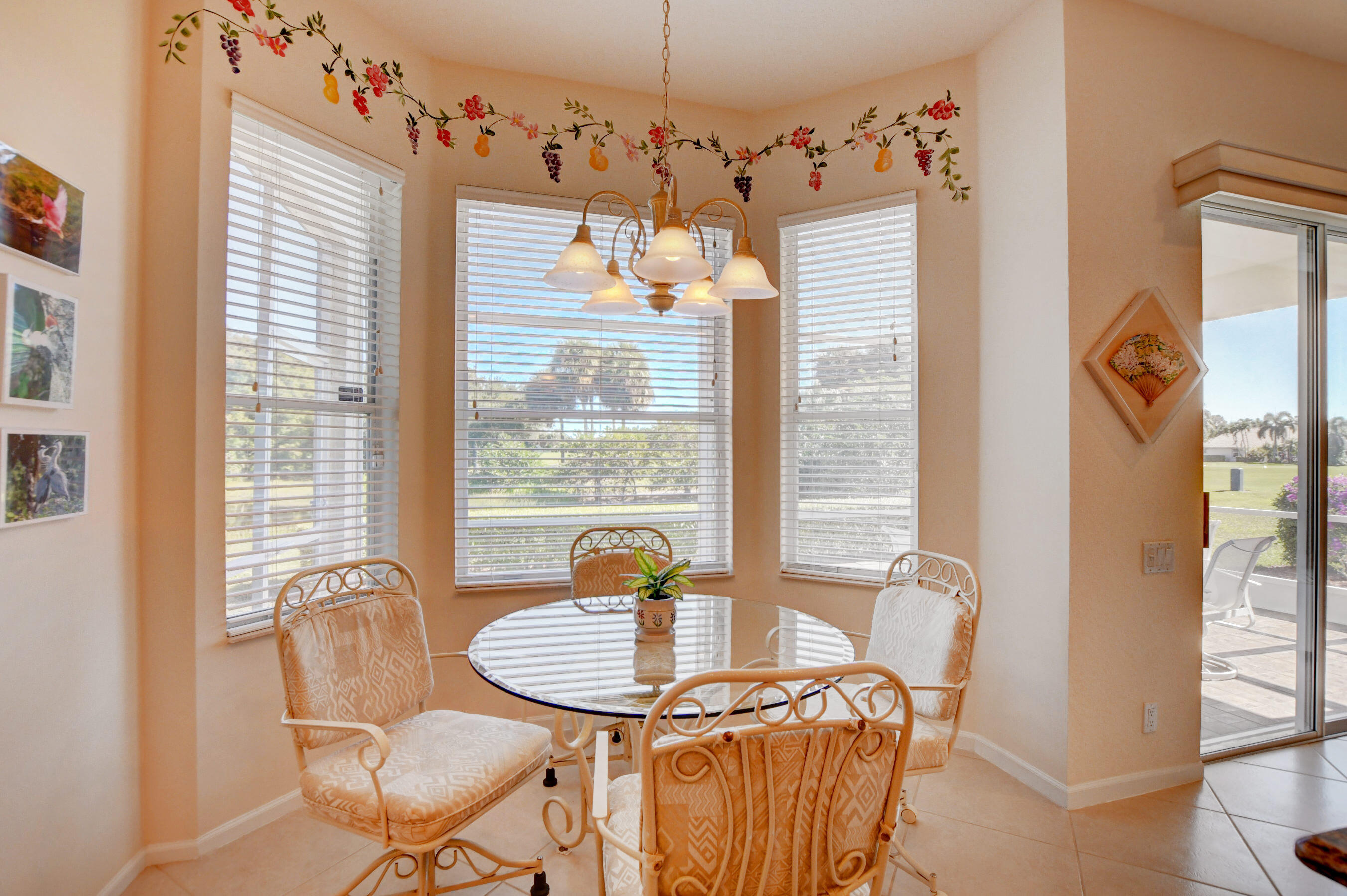 7097 Haviland Circle Boynton Beach, FL 33437 - Photo 12 of 72 a dining room with furniture and window