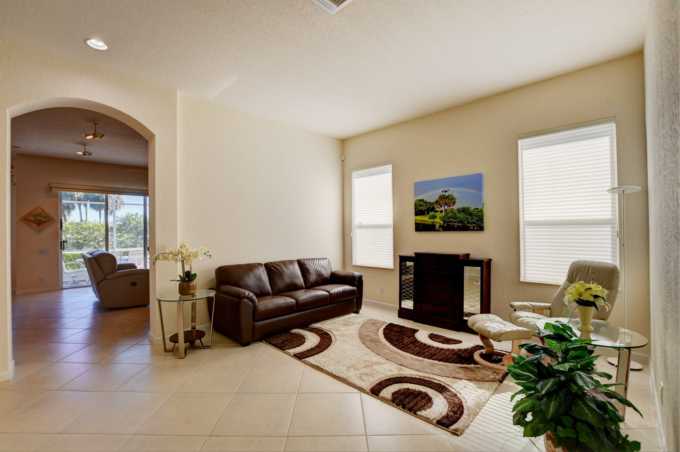 7097 Haviland Circle Boynton Beach, FL 33437 - Photo 25 of 72 a living room with furniture and a fireplace