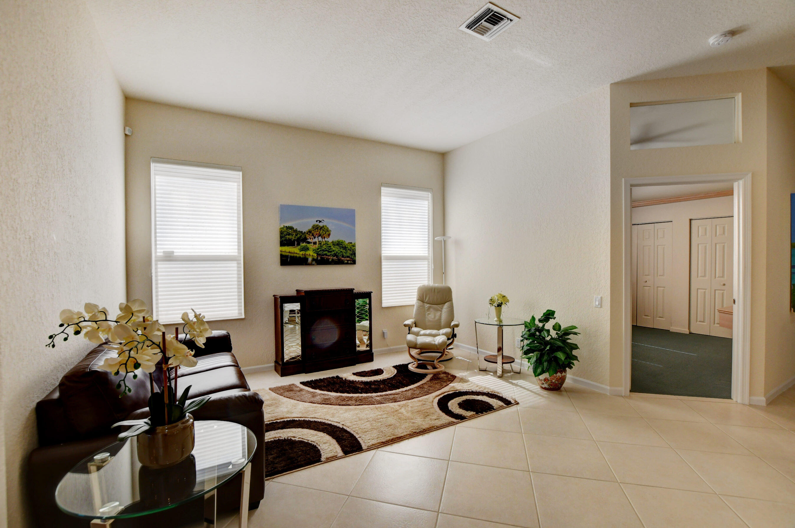 7097 Haviland Circle Boynton Beach, FL 33437 - Photo 26 of 72 a living room with furniture and a fireplace