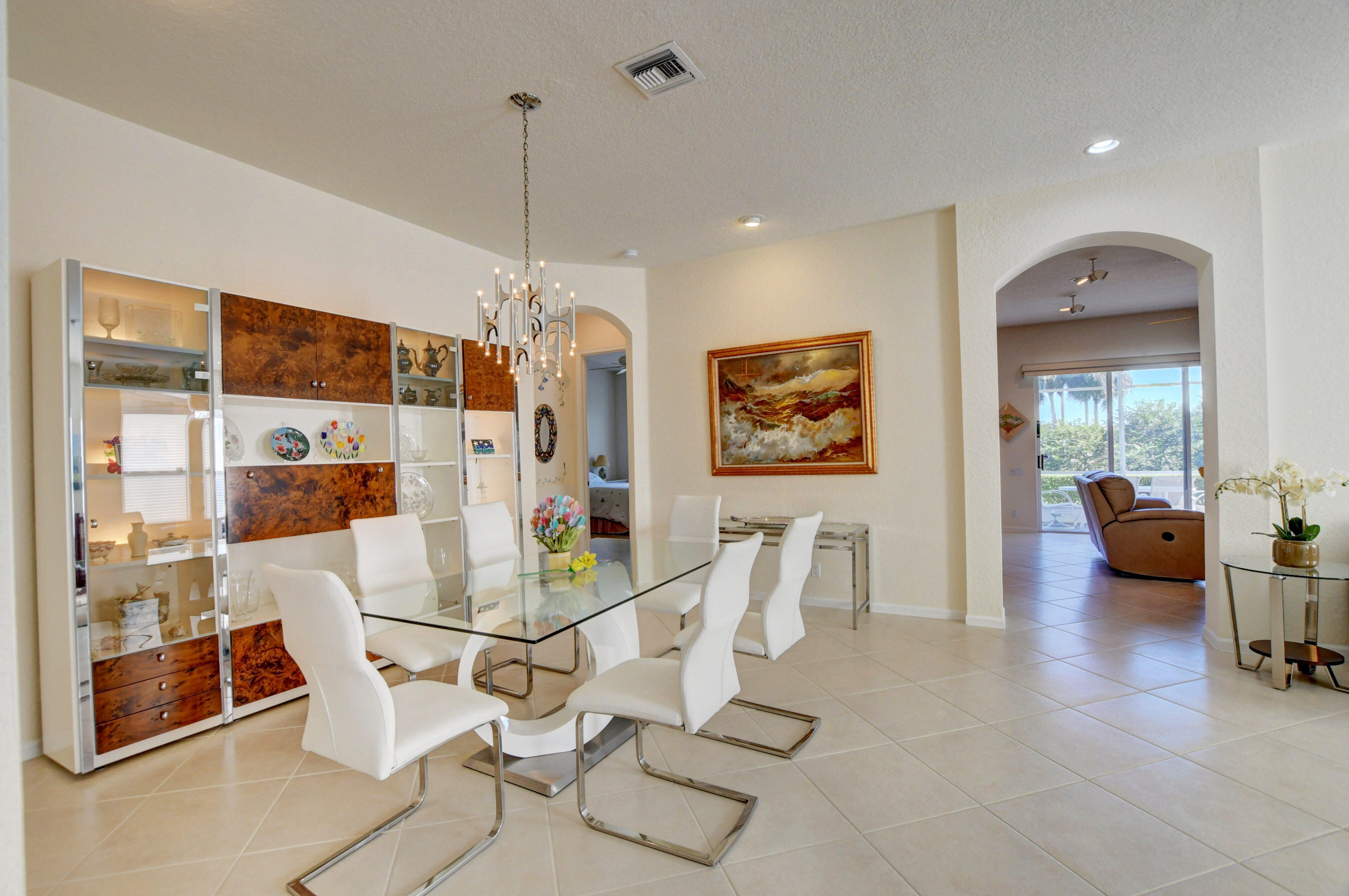 7097 Haviland Circle Boynton Beach, FL 33437 - Photo 27 of 72 a view of a livingroom with furniture and floor to ceiling window