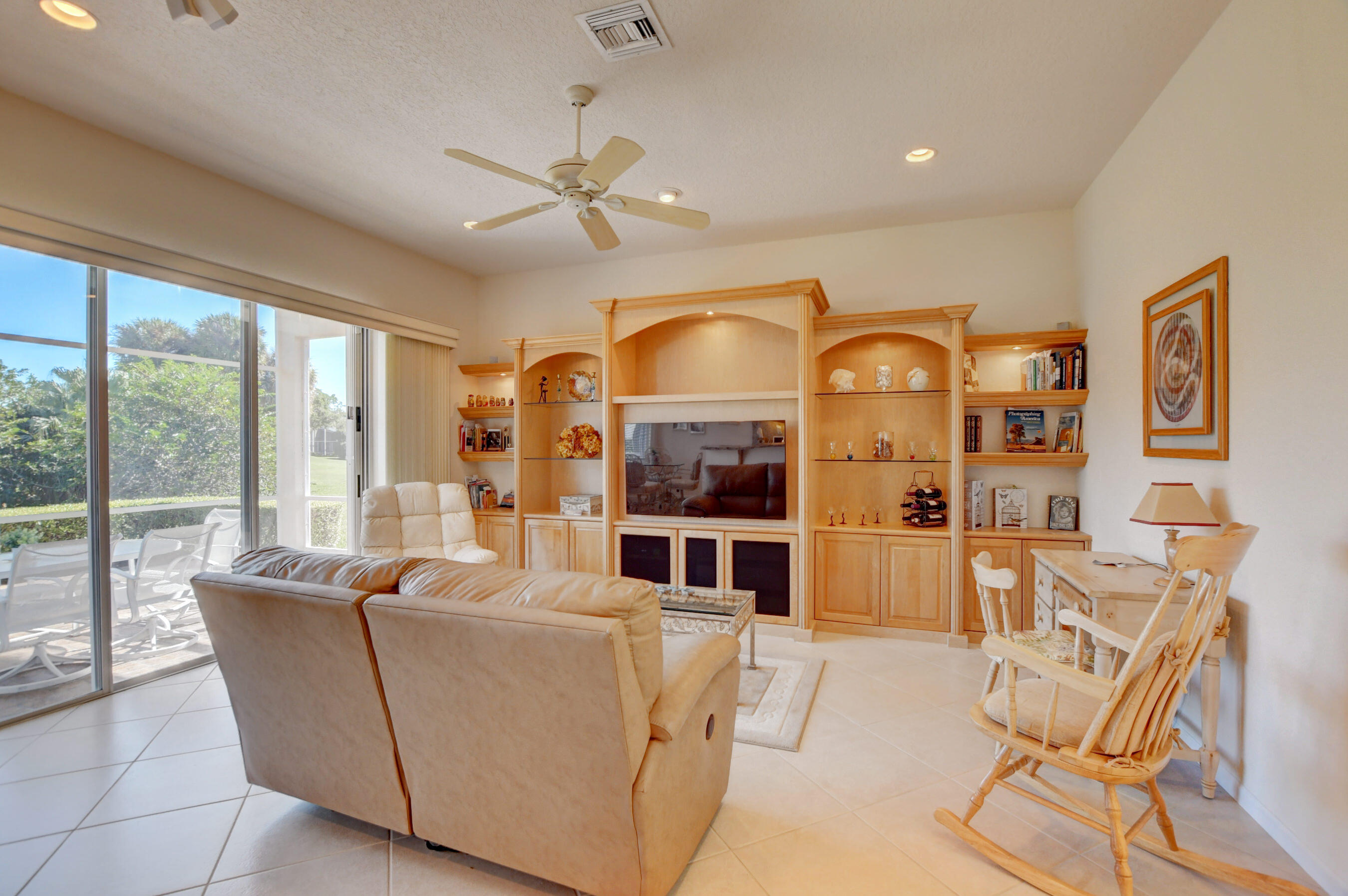 7097 Haviland Circle Boynton Beach, FL 33437 - Photo 30 of 72 a living room with furniture and a large window