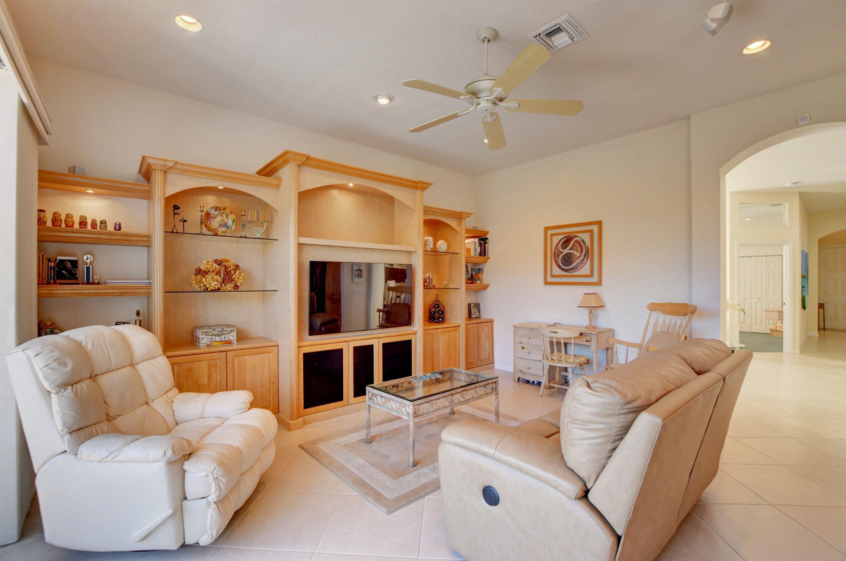 7097 Haviland Circle Boynton Beach, FL 33437 - Photo 32 of 72 a living room with furniture a dining table and chairs
