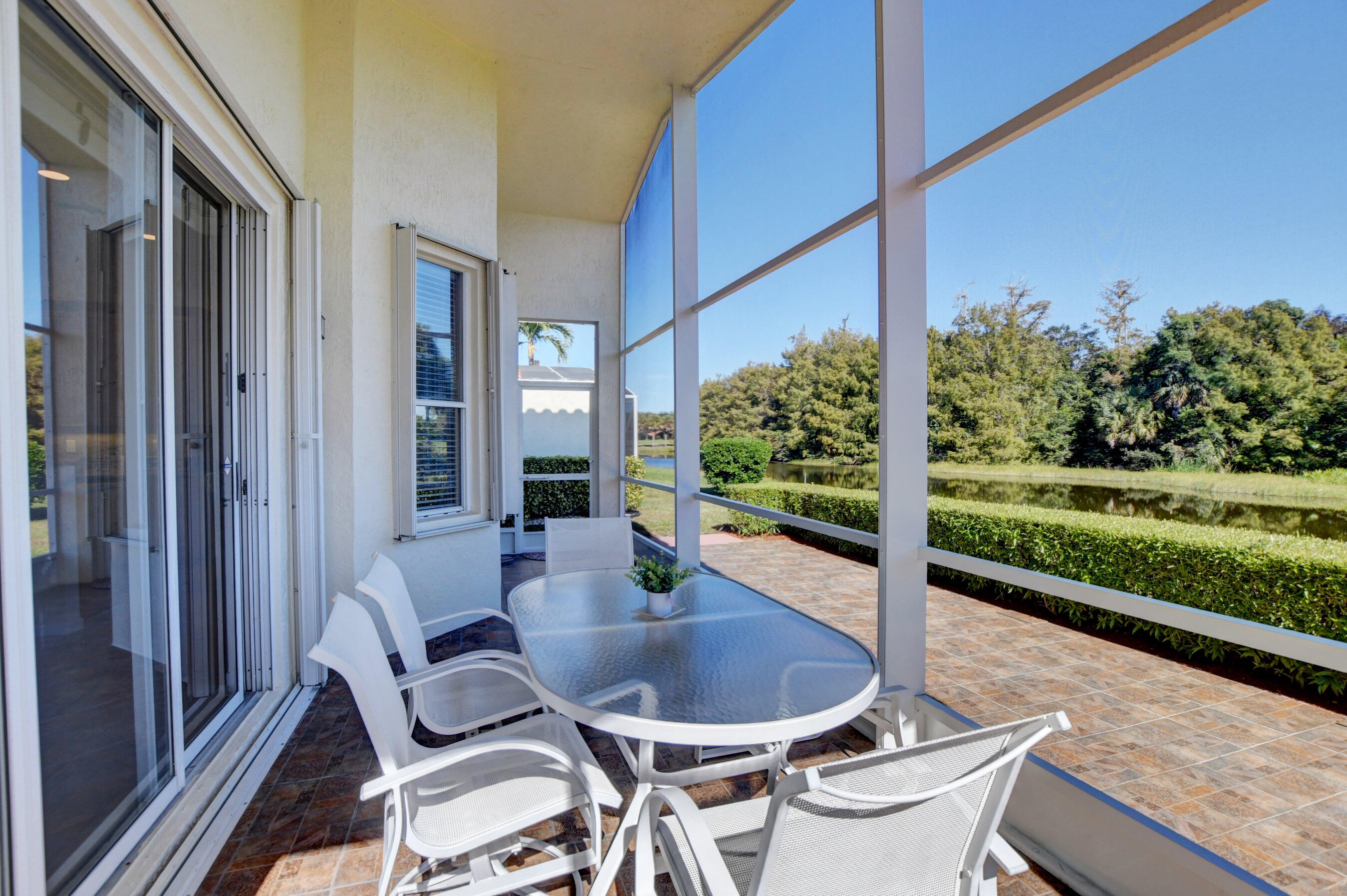 7097 Haviland Circle Boynton Beach, FL 33437 - Photo 35 of 72 a dining area with furniture and garden view