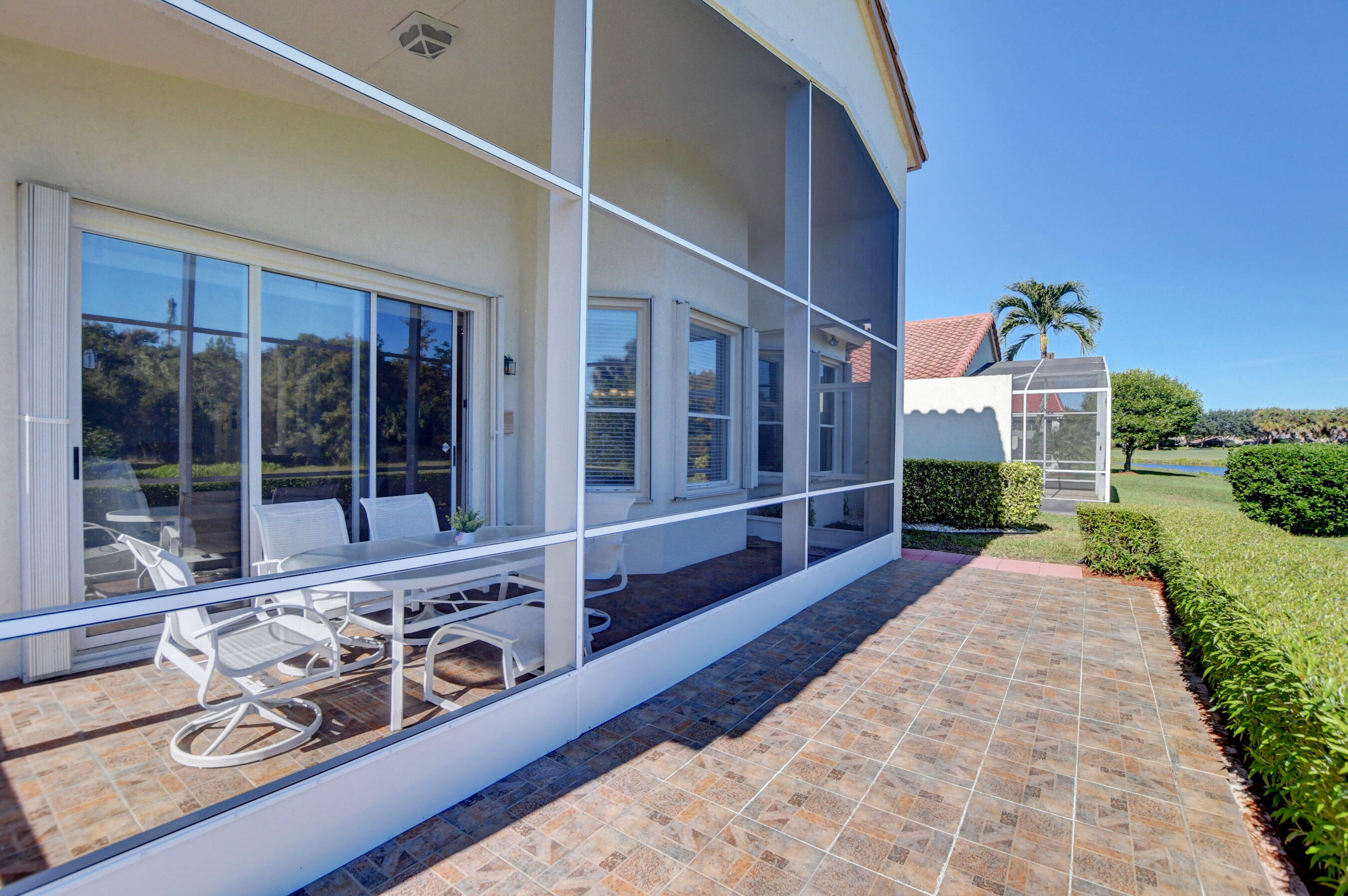 7097 Haviland Circle Boynton Beach, FL 33437 - Photo 38 of 72 a view of a house with a porch
