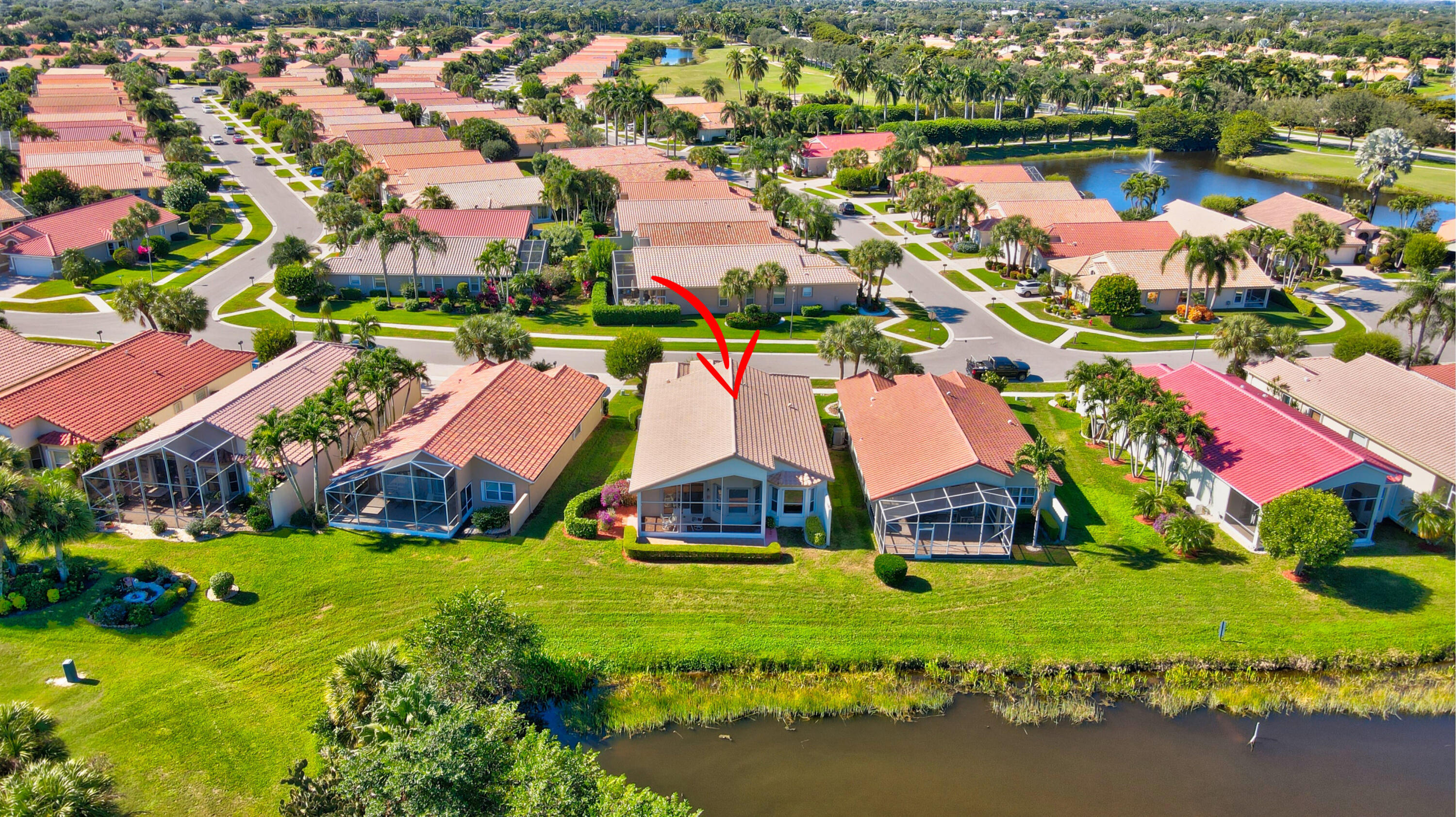 7097 Haviland Circle Boynton Beach, FL 33437 - Photo 52 of 72 an aerial view of residential houses with outdoor space and lake view