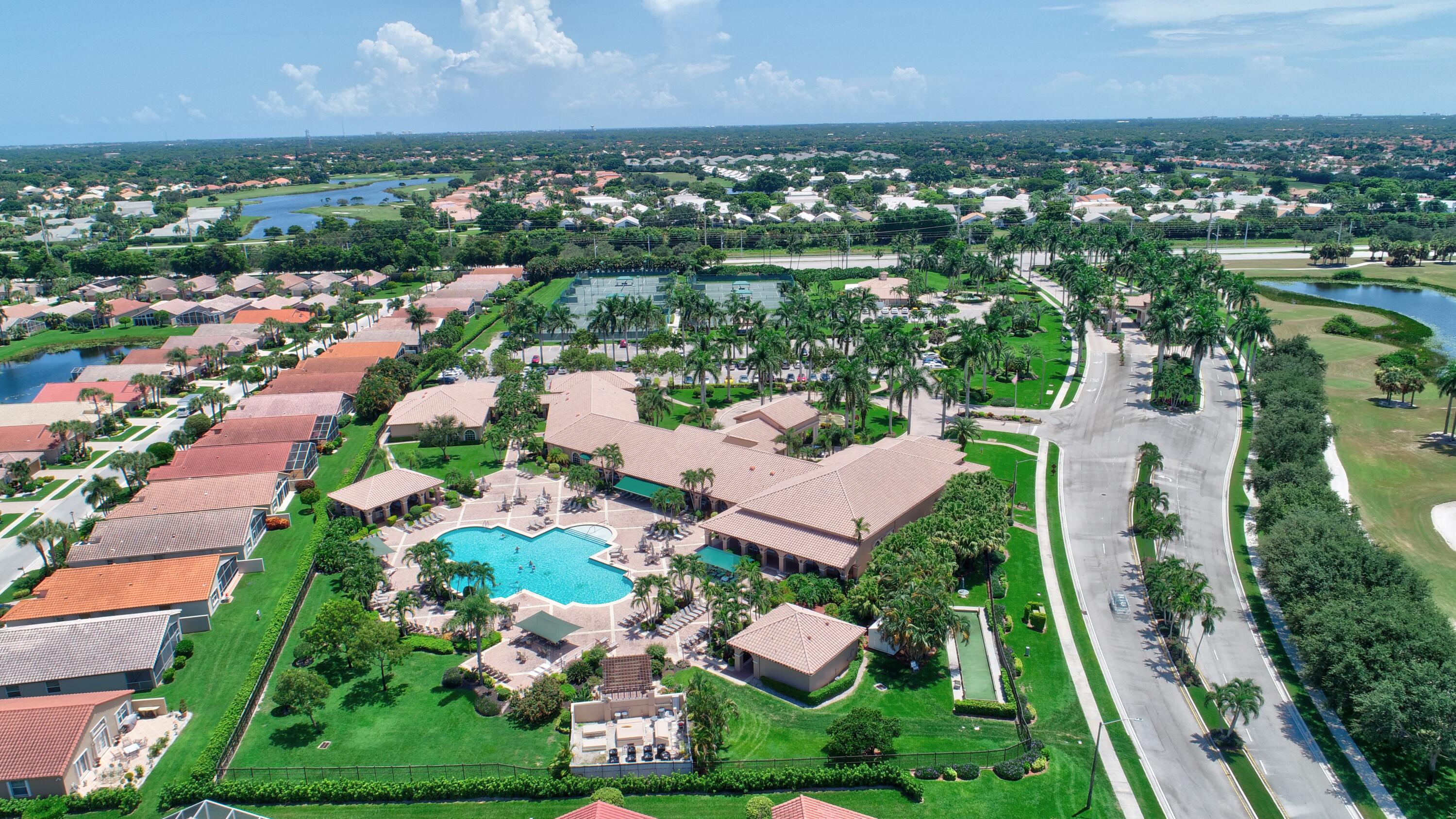 7097 Haviland Circle Boynton Beach, FL 33437 - Photo 64 of 72 an aerial view of residential houses with outdoor space and trees