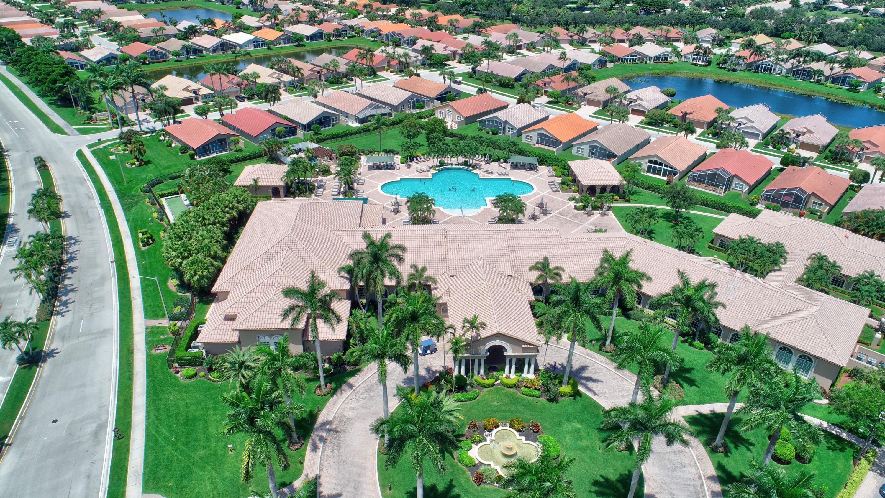 7097 Haviland Circle Boynton Beach, FL 33437 - Photo 65 of 72 an aerial view of residential houses with outdoor space and trees all around