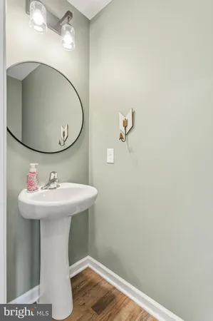 a bathroom with a sink and mirror