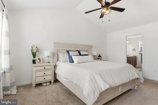 a bedroom with a bed and cabinet