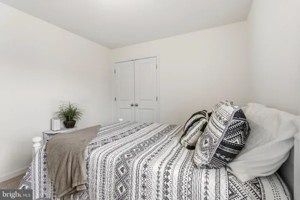 a view of a bedroom with a bed