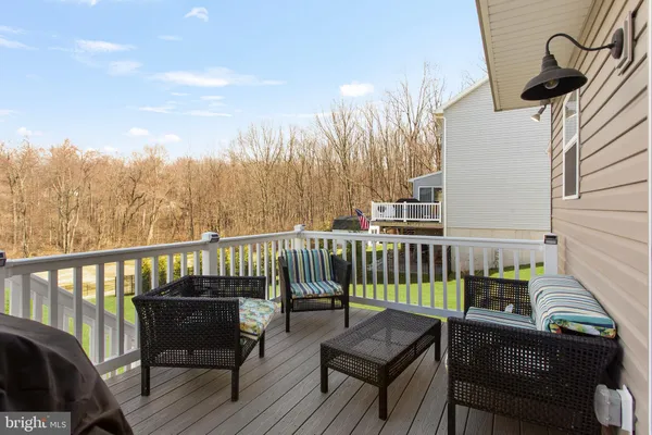 a view of a balcony with furniture