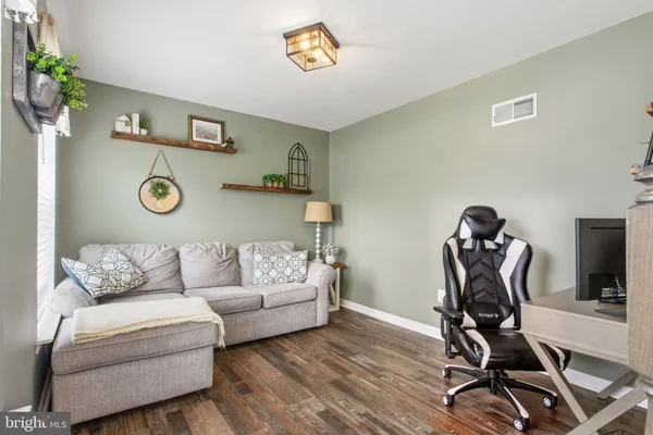 a view of a livingroom with furniture and a couch