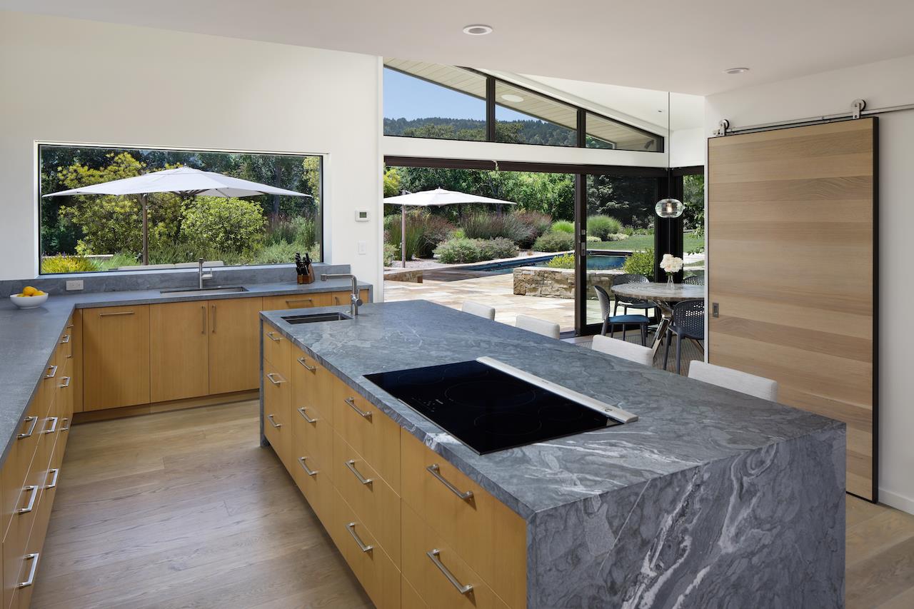 396 Raymundo Drive Woodside, CA 94062 - Photo 14 of 58 a kitchen with stainless steel appliances granite countertop a stove and a wooden cabinets