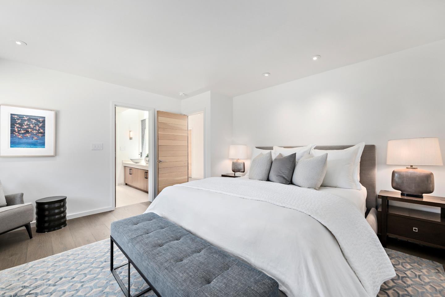 396 Raymundo Drive Woodside, CA 94062 - Photo 2 of 58 a spacious bedroom with a bed and wooden floor