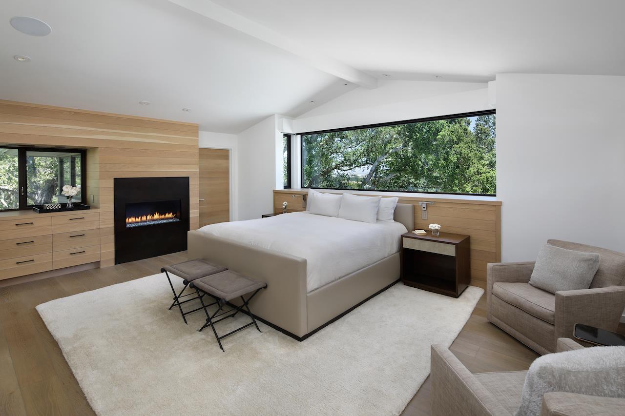 396 Raymundo Drive Woodside, CA 94062 - Photo 30 of 58 a living room with furniture and a fireplace