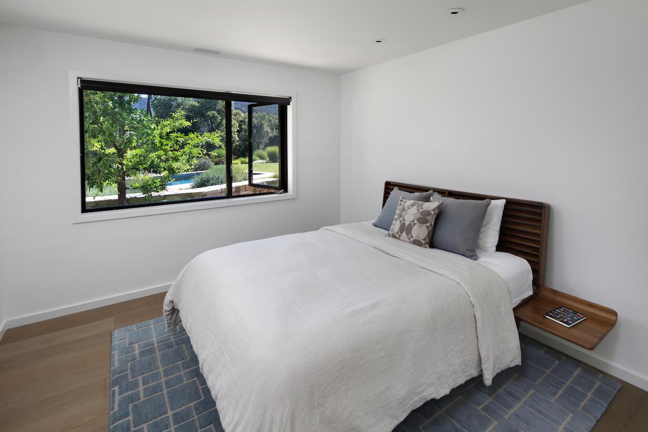 396 Raymundo Drive Woodside, CA 94062 - Photo 33 of 58 a bedroom with a bed and a window