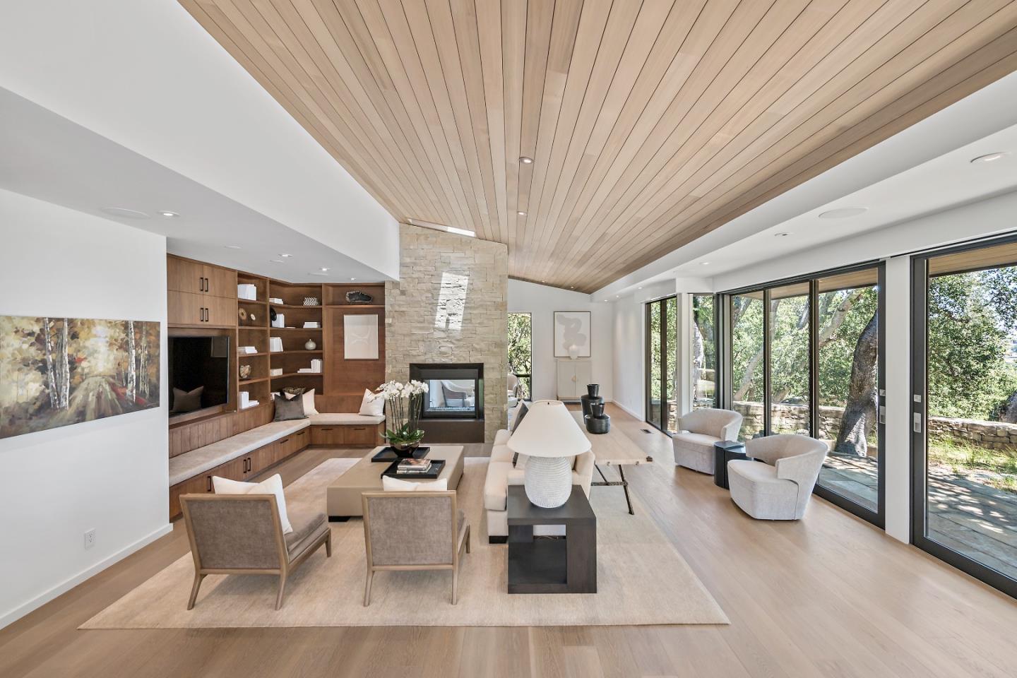 396 Raymundo Drive Woodside, CA 94062 - Photo 34 of 58 a living room with furniture and a fireplace