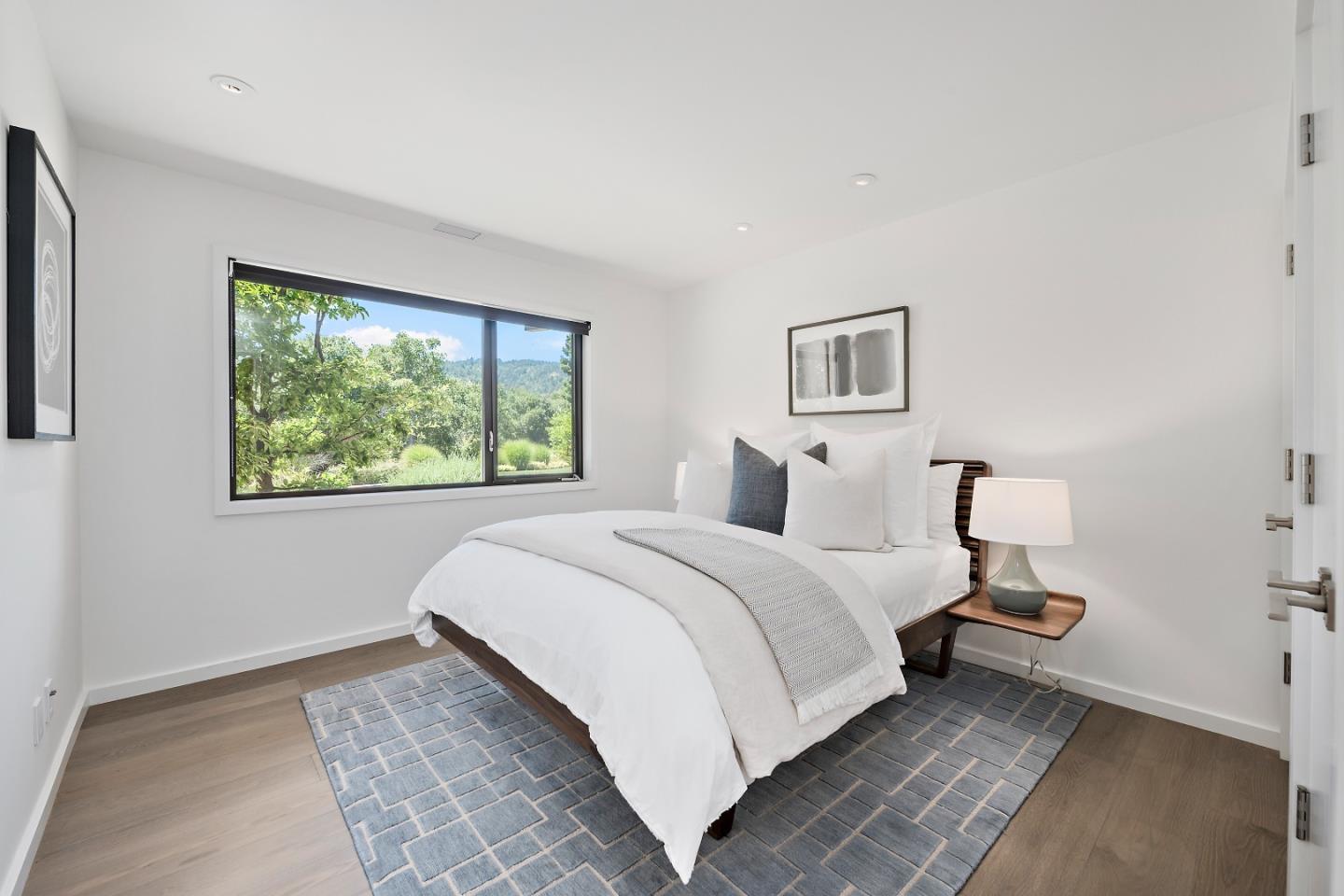396 Raymundo Drive Woodside, CA 94062 - Photo 44 of 58 a bedroom with a bed and window