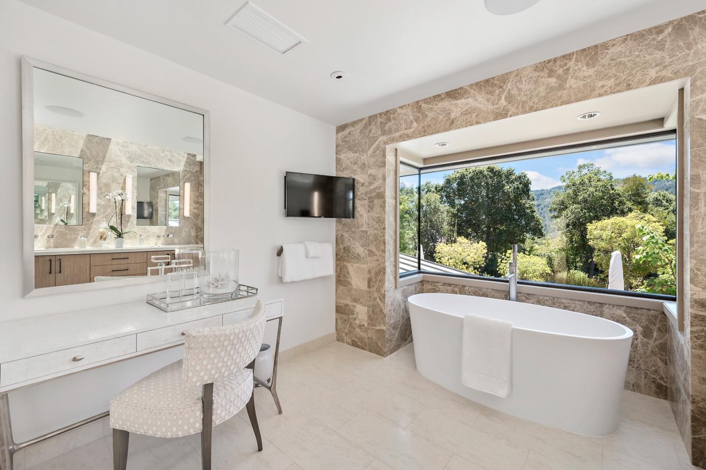 396 Raymundo Drive Woodside, CA 94062 - Photo 46 of 58 a living room with furniture a large window and a flat screen tv
