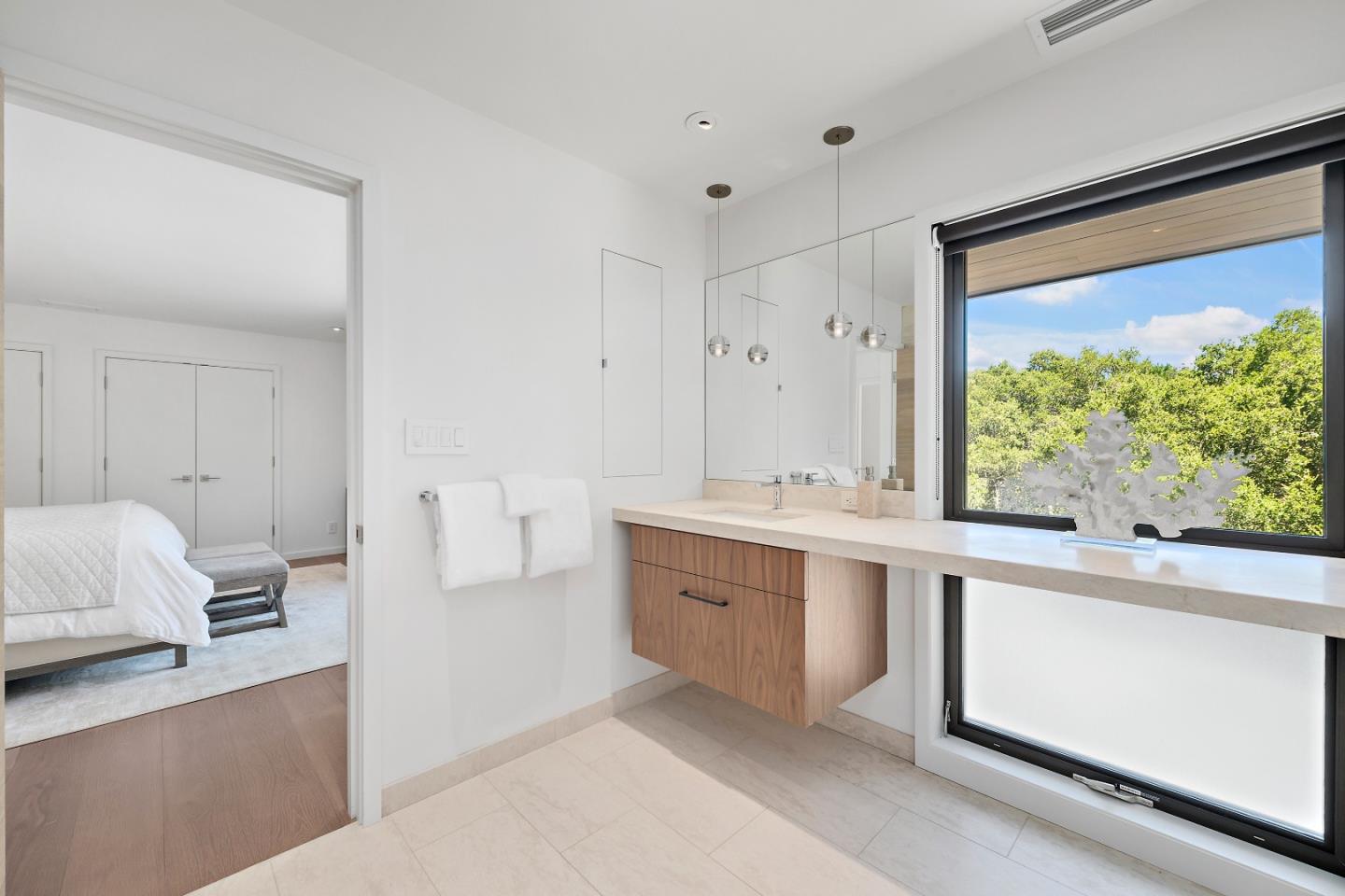 396 Raymundo Drive Woodside, CA 94062 - Photo 48 of 58 a large white room with a large window and sink