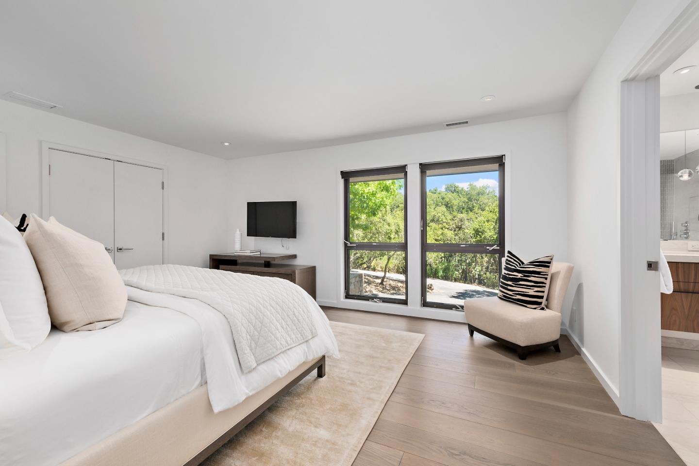 396 Raymundo Drive Woodside, CA 94062 - Photo 49 of 58 a bedroom with a bed and a couch