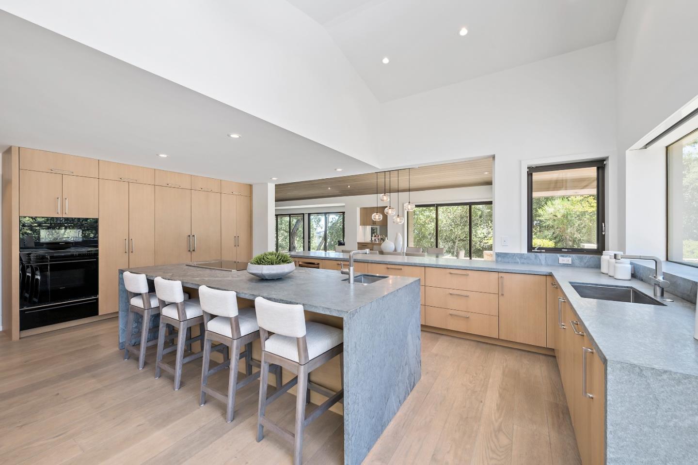 396 Raymundo Drive Woodside, CA 94062 - Photo 50 of 58 a large kitchen with kitchen island a large island in it