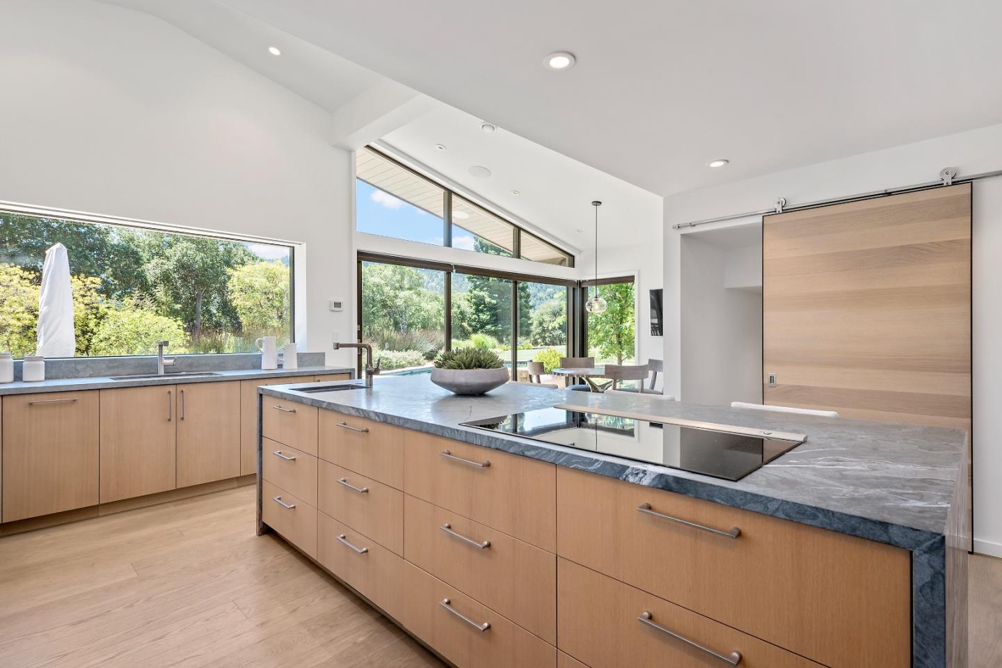 396 Raymundo Drive Woodside, CA 94062 - Photo 5 of 58 a kitchen with sink attached with living room