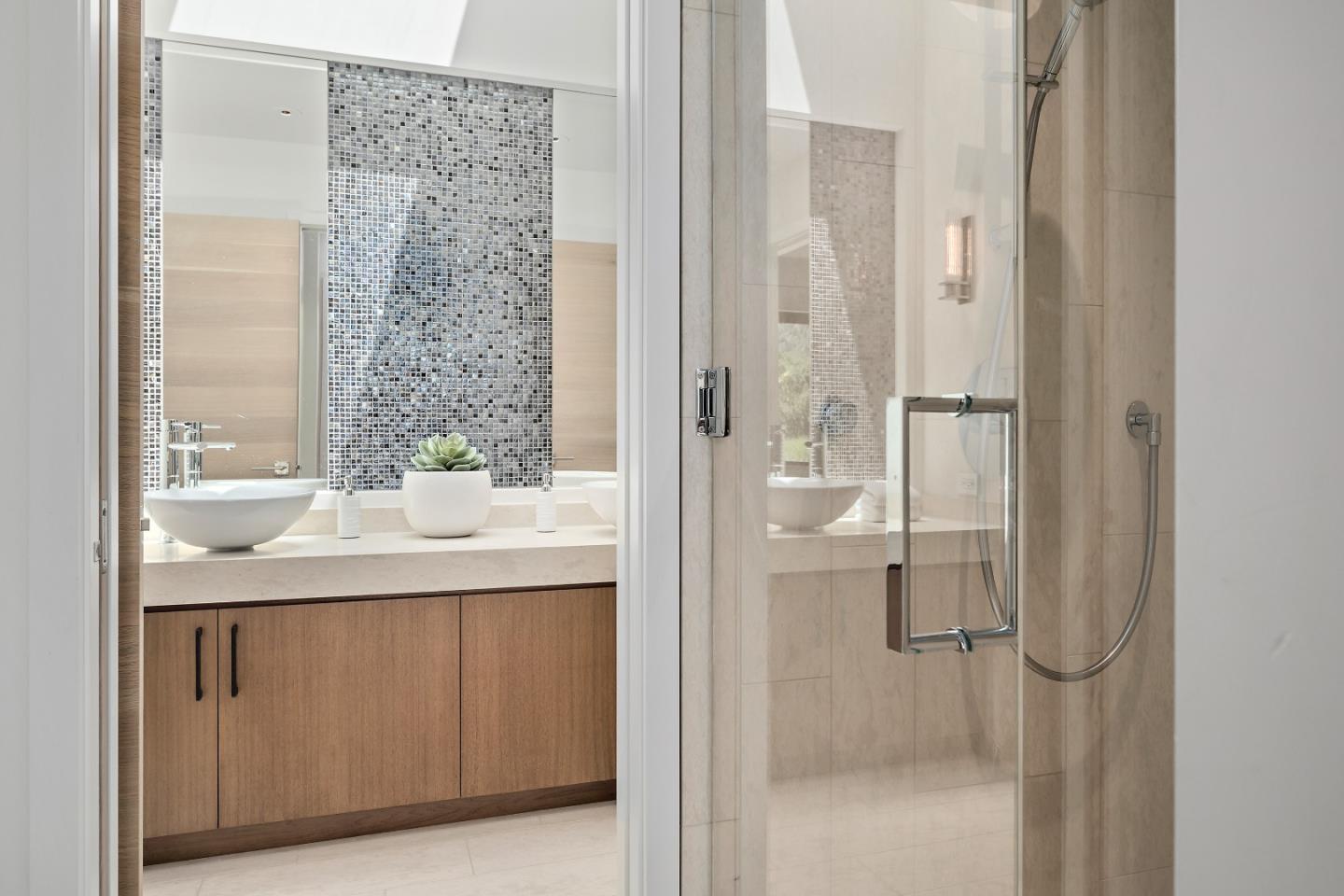 396 Raymundo Drive Woodside, CA 94062 - Photo 54 of 58 a bathroom with a granite countertop sink two mirror and shower