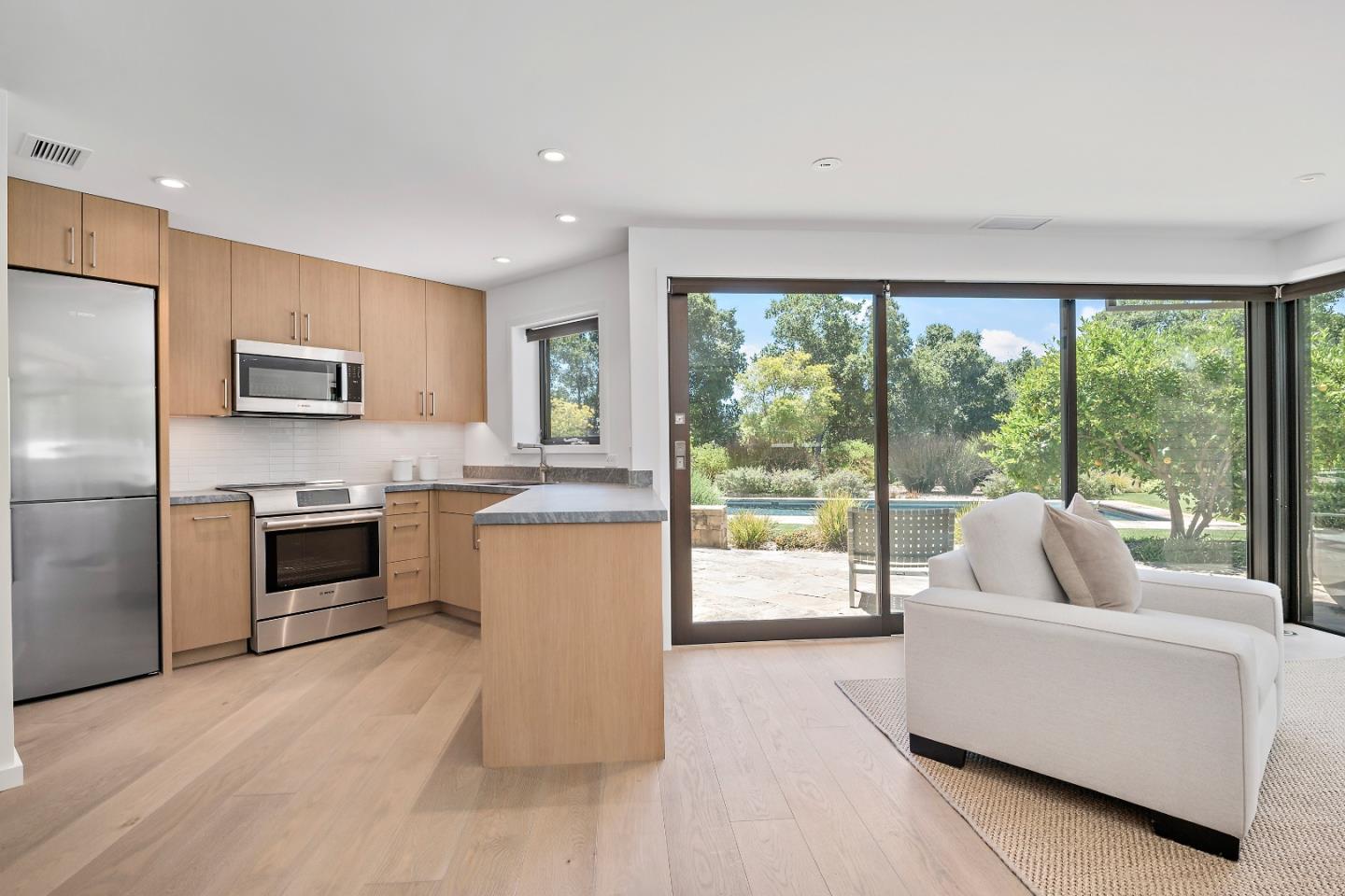 396 Raymundo Drive Woodside, CA 94062 - Photo 57 of 58 a kitchen with a stove a sink and a refrigerator