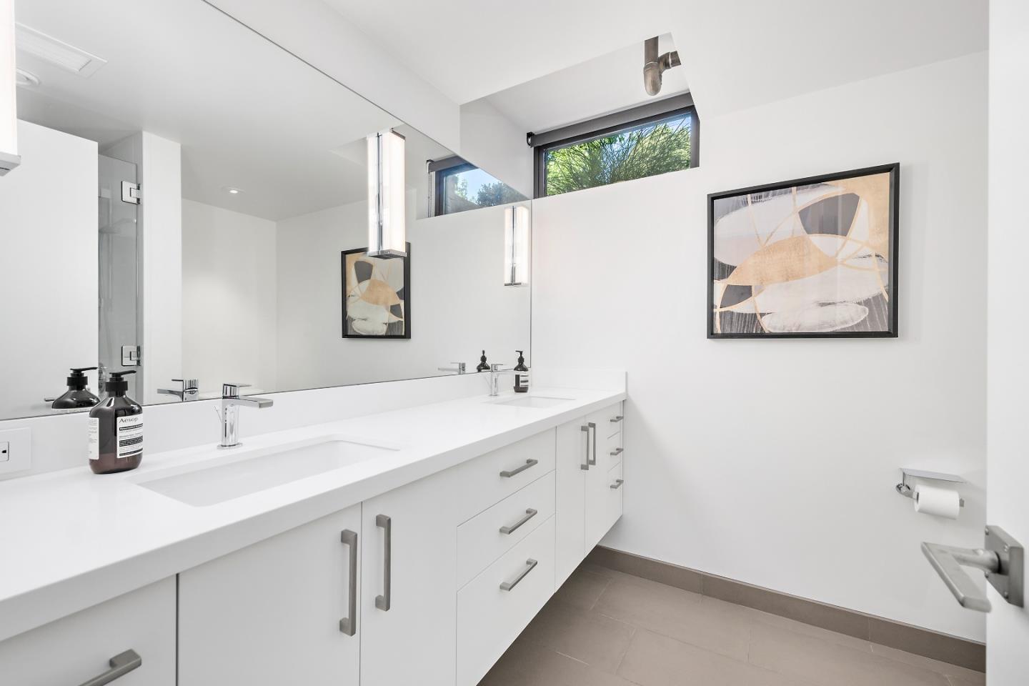 396 Raymundo Drive Woodside, CA 94062 - Photo 7 of 58 a bathroom with a double vanity sink and a mirror