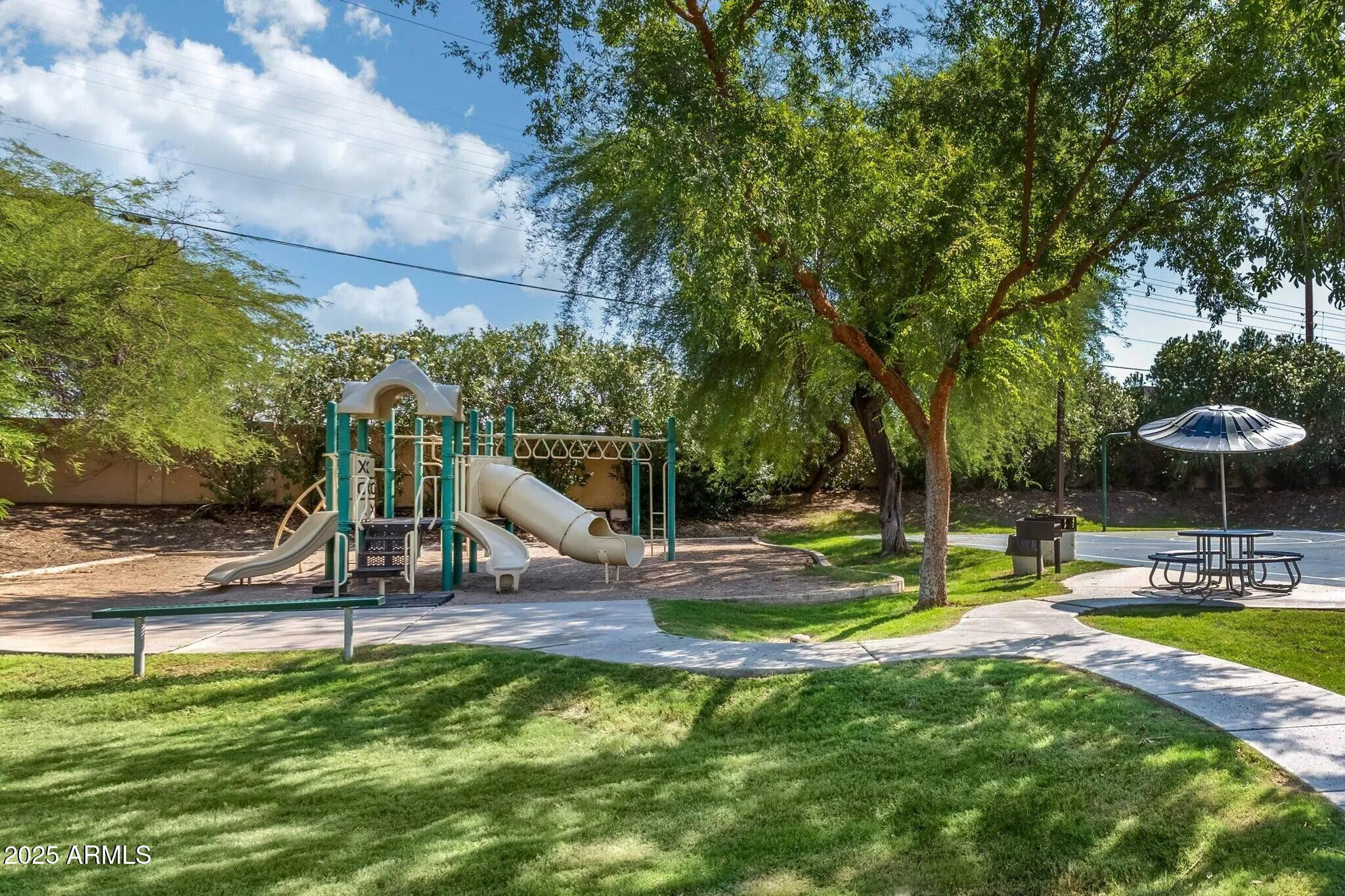 5102 East Piedmont Road, Unit B2 Phoenix, AZ 85044 - Photo 6 of 8 a view of a park with swings