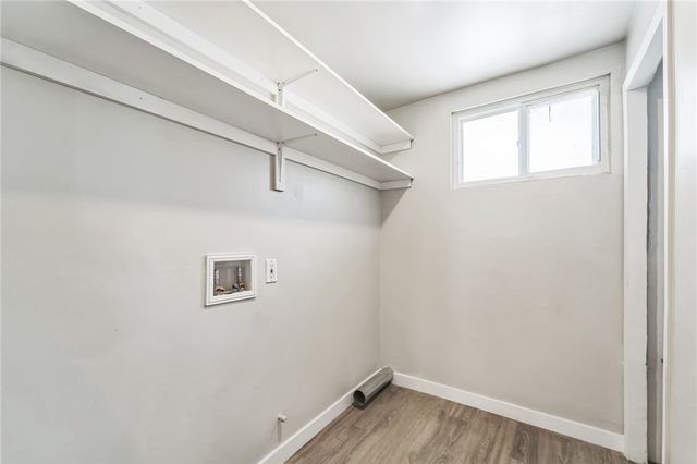 a view of a hallway with a wooden floor