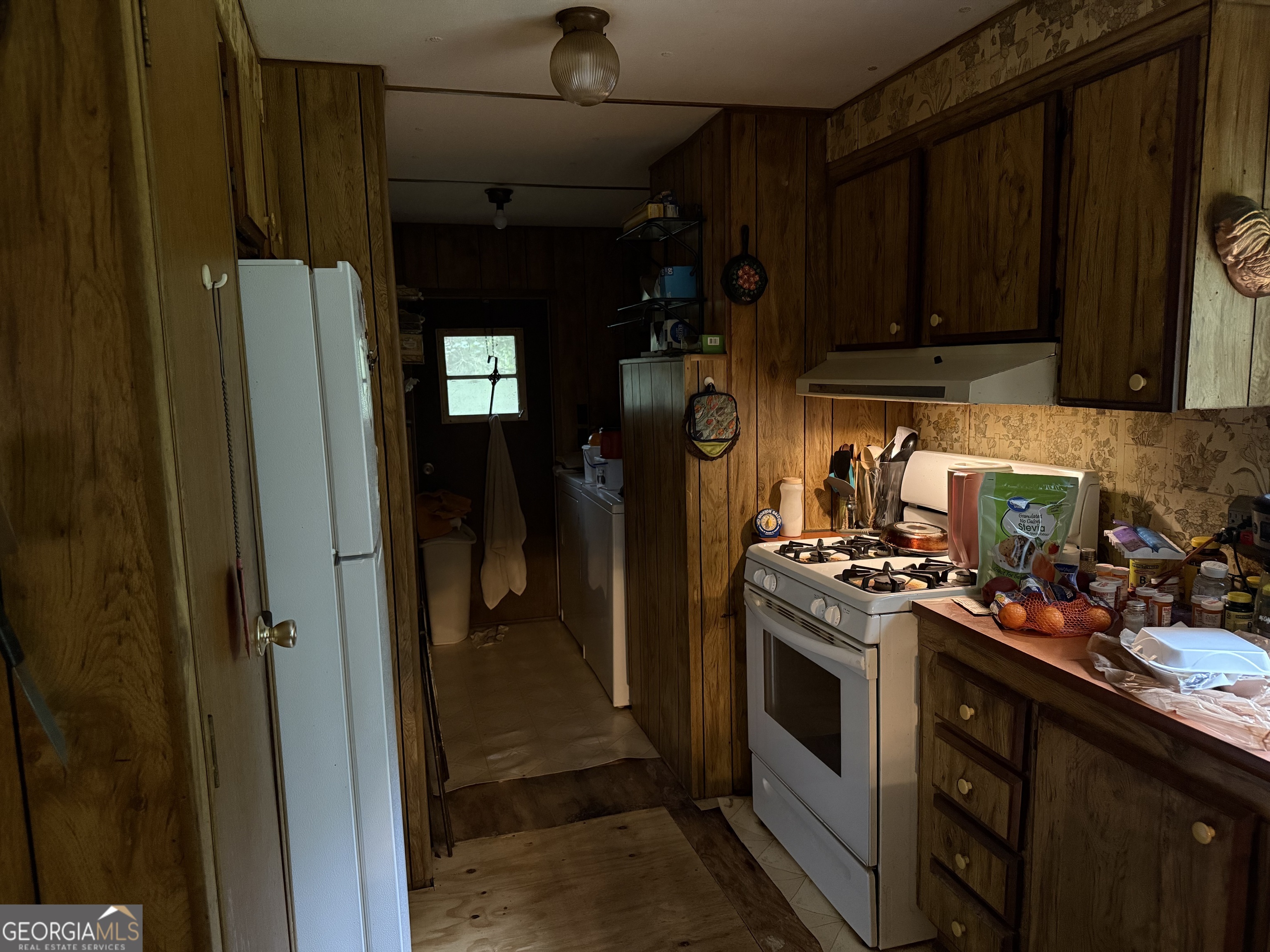 2387 5 Points Road Waco, GA 30182 - Photo 5 of 8 a kitchen with stainless steel appliances granite countertop a stove and a refrigerator